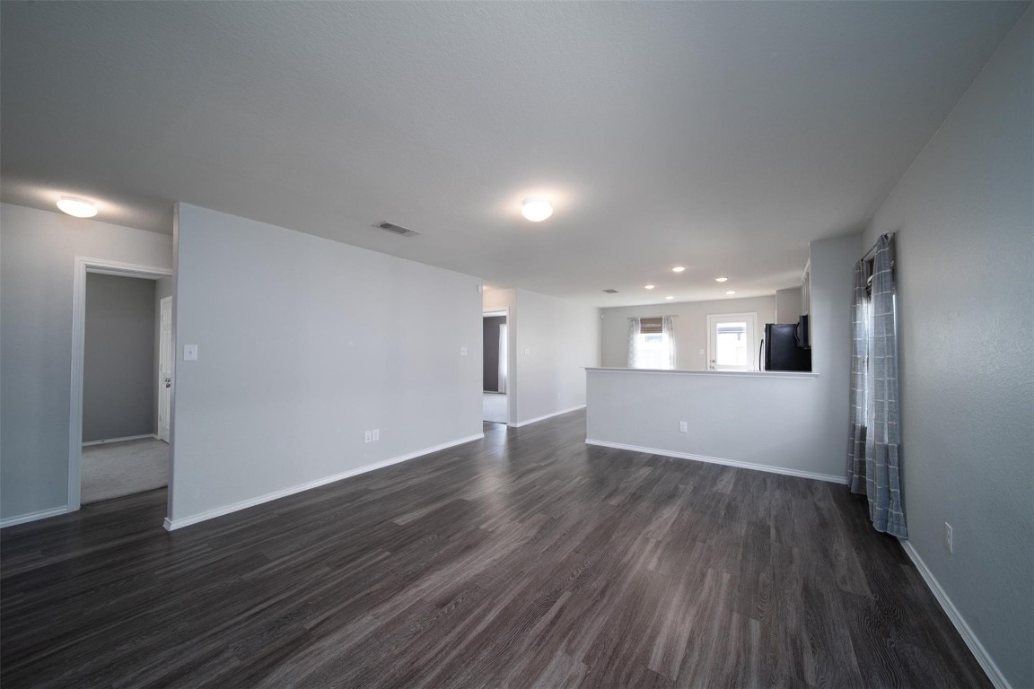 24023 Swather Way Hockley, TX 77447 - Photo 11 of 26 a view of empty room with wooden floor