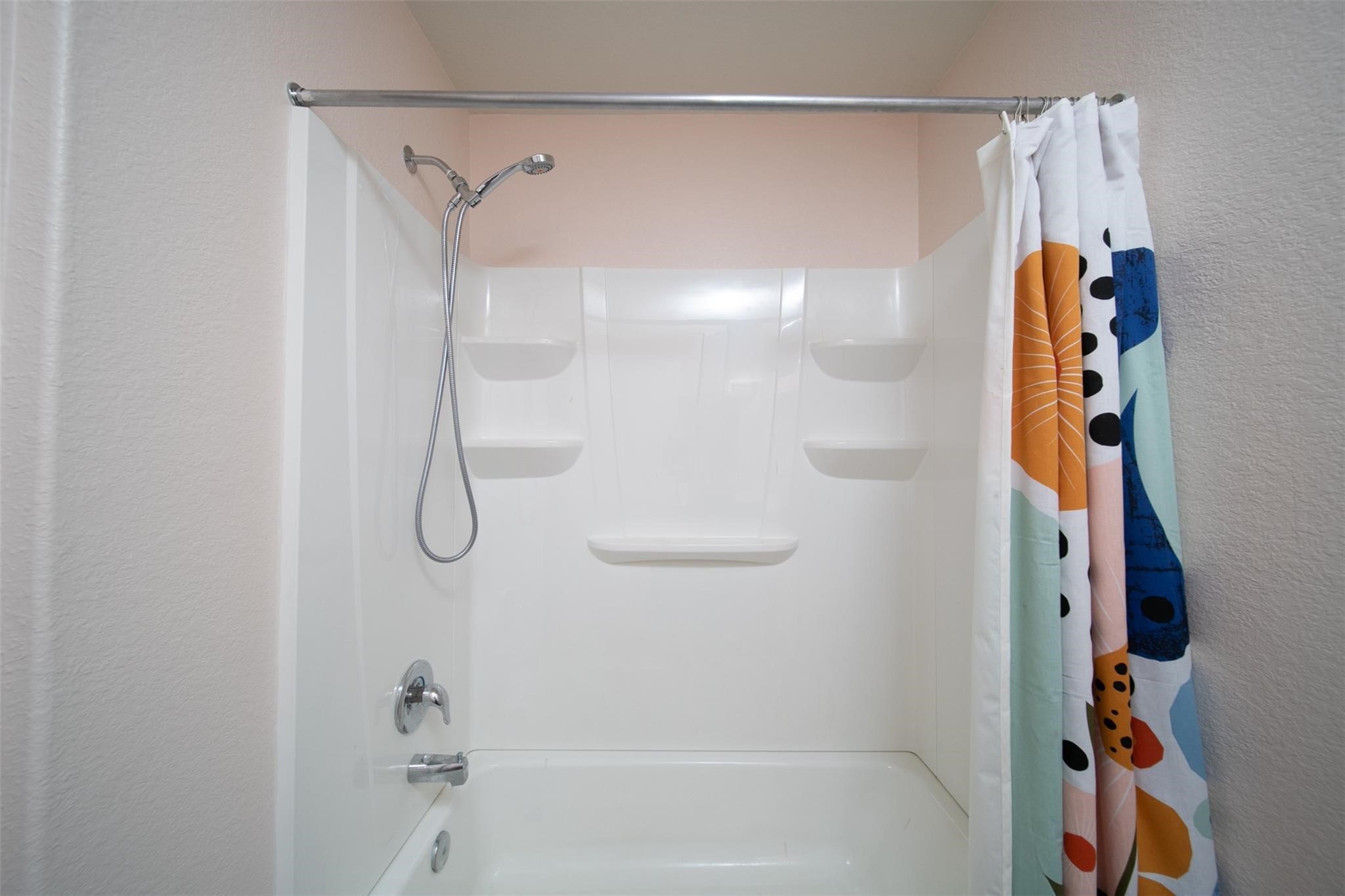 24023 Swather Way Hockley, TX 77447 - Photo 19 of 26 a bathroom with a shower and a bath tub