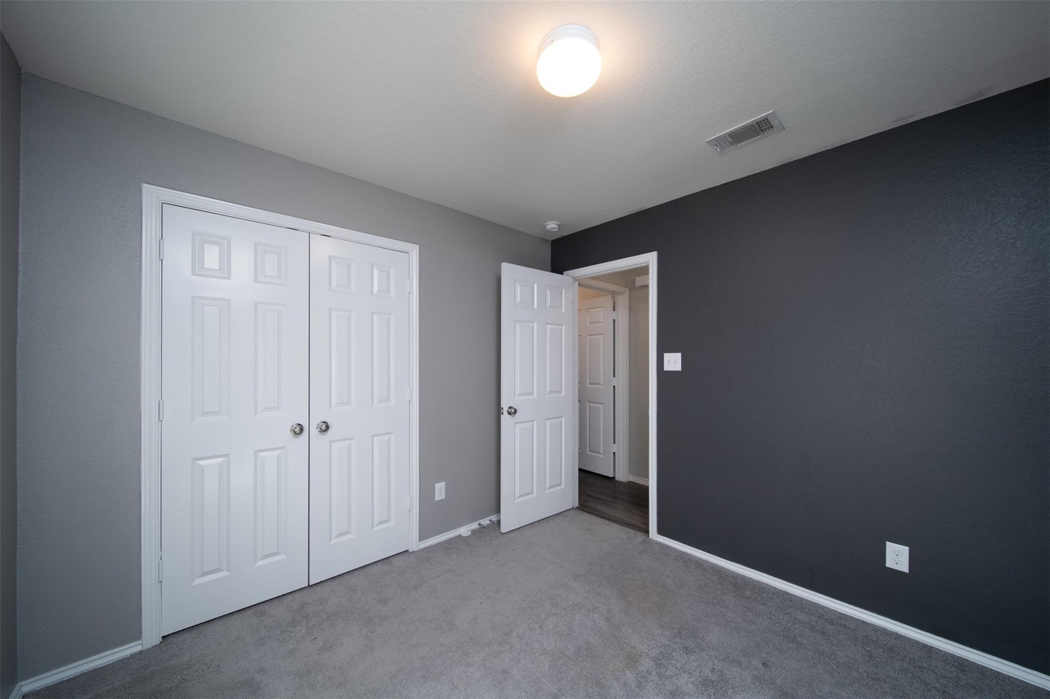 24023 Swather Way Hockley, TX 77447 - Photo 20 of 26 an empty room with closet and a bathroom