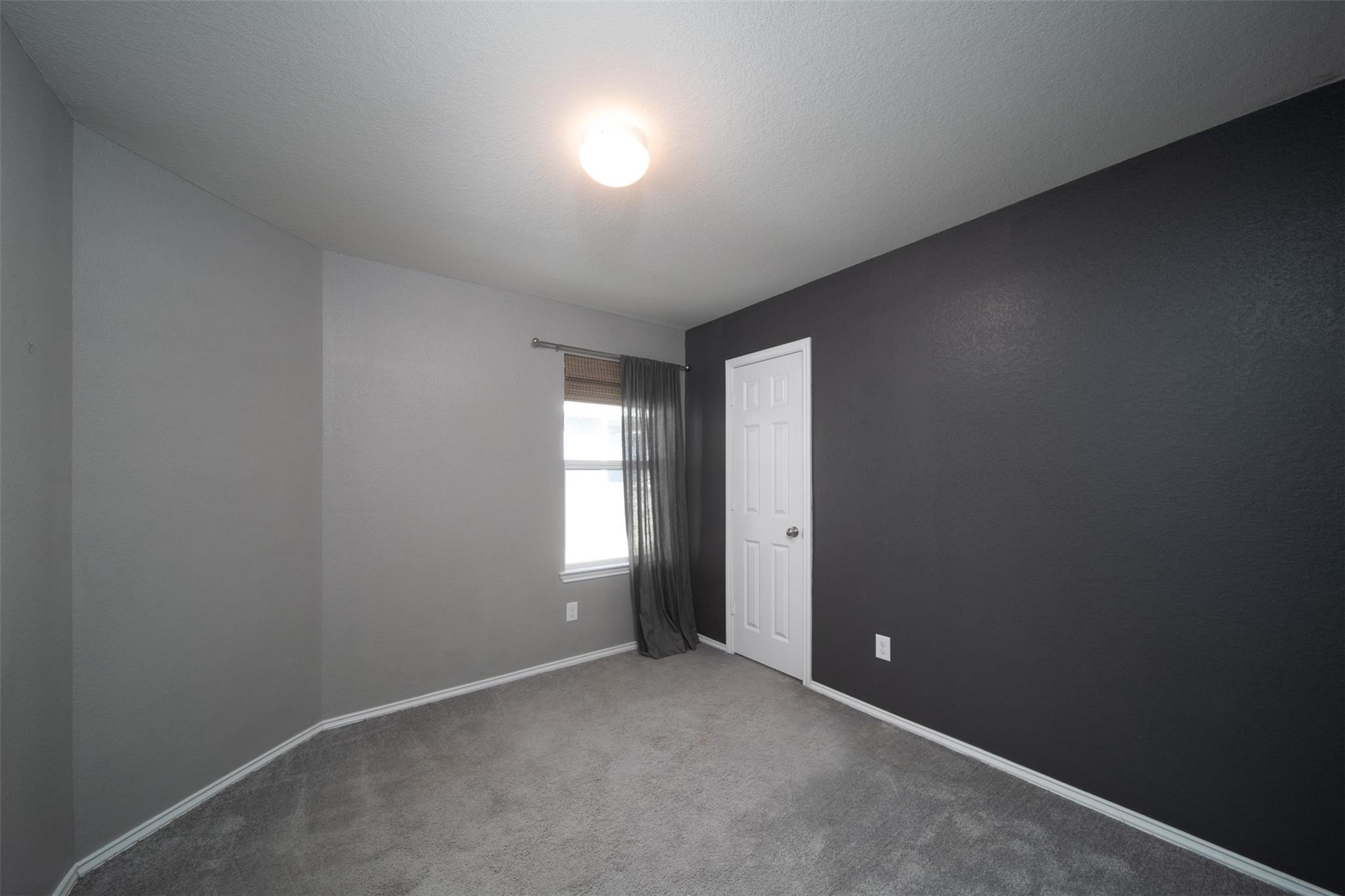 24023 Swather Way Hockley, TX 77447 - Photo 22 of 26 an empty room with windows