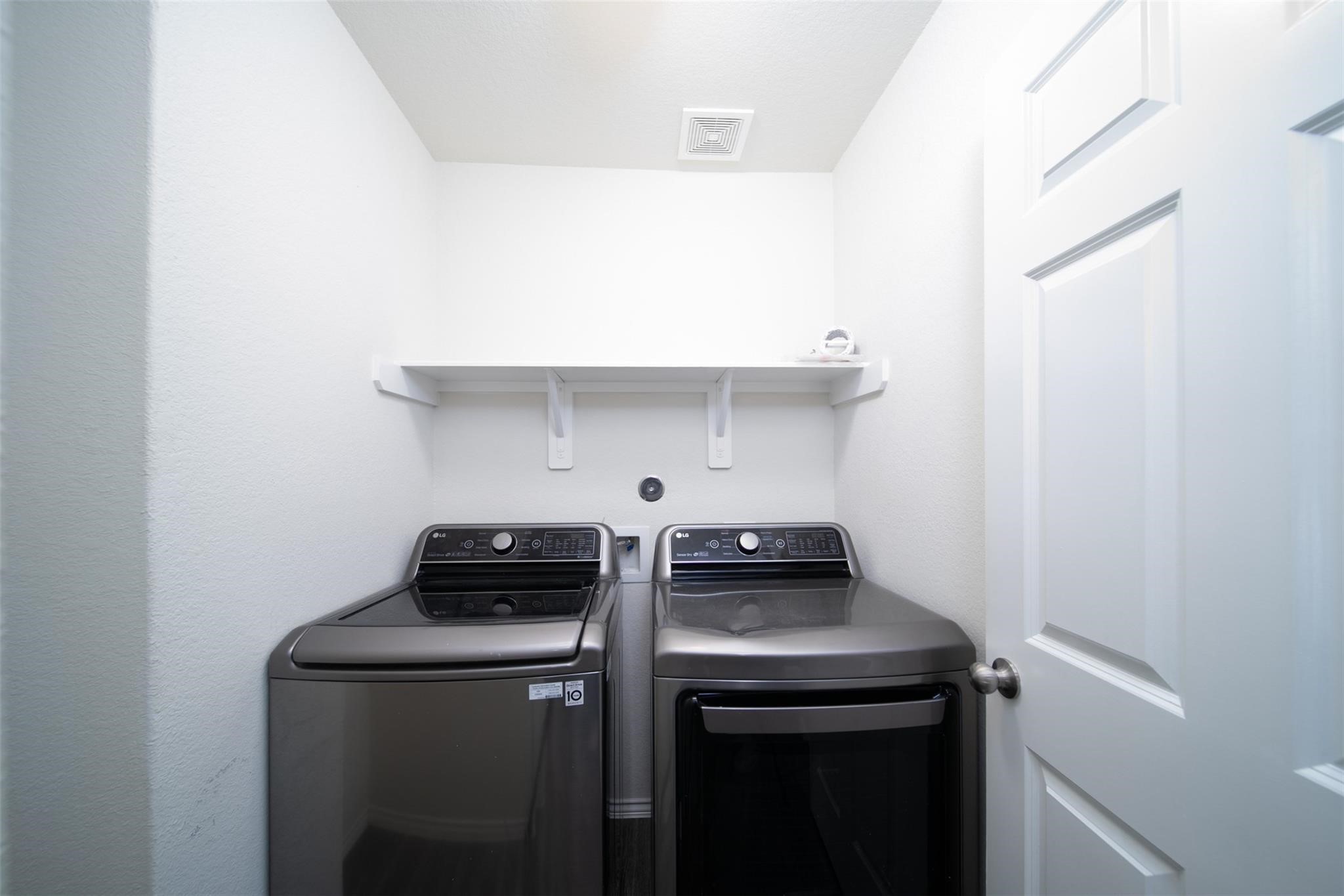 24023 Swather Way Hockley, TX 77447 - Photo 26 of 26 a view of storage and utility room with washer and dryer