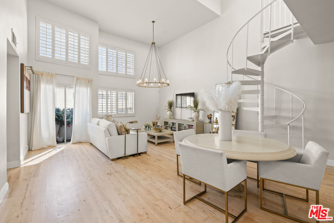 11822 Goshen Avenue, Unit 301 Los Angeles, CA 90049 - Photo 1 of 29 a living room with furniture and wooden floor