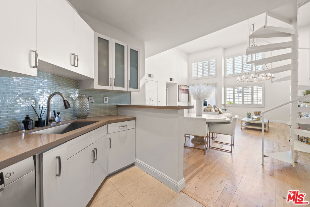 11822 Goshen Avenue, Unit 301 Los Angeles, CA 90049 - Photo 10 of 29 a kitchen with sink and cabinets