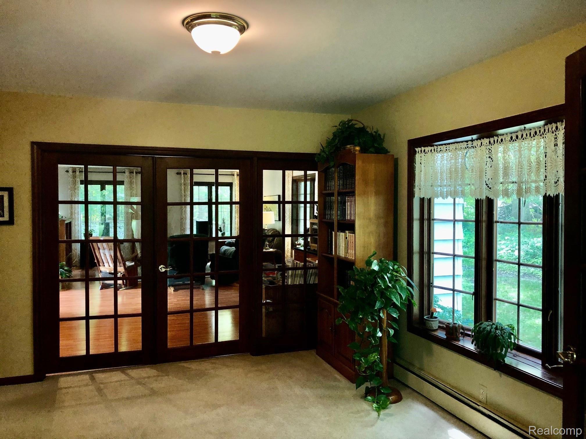 5975 Ludwig Road Oxford, MI 48371 - Photo 36 of 73 French door entry to gathering/media room