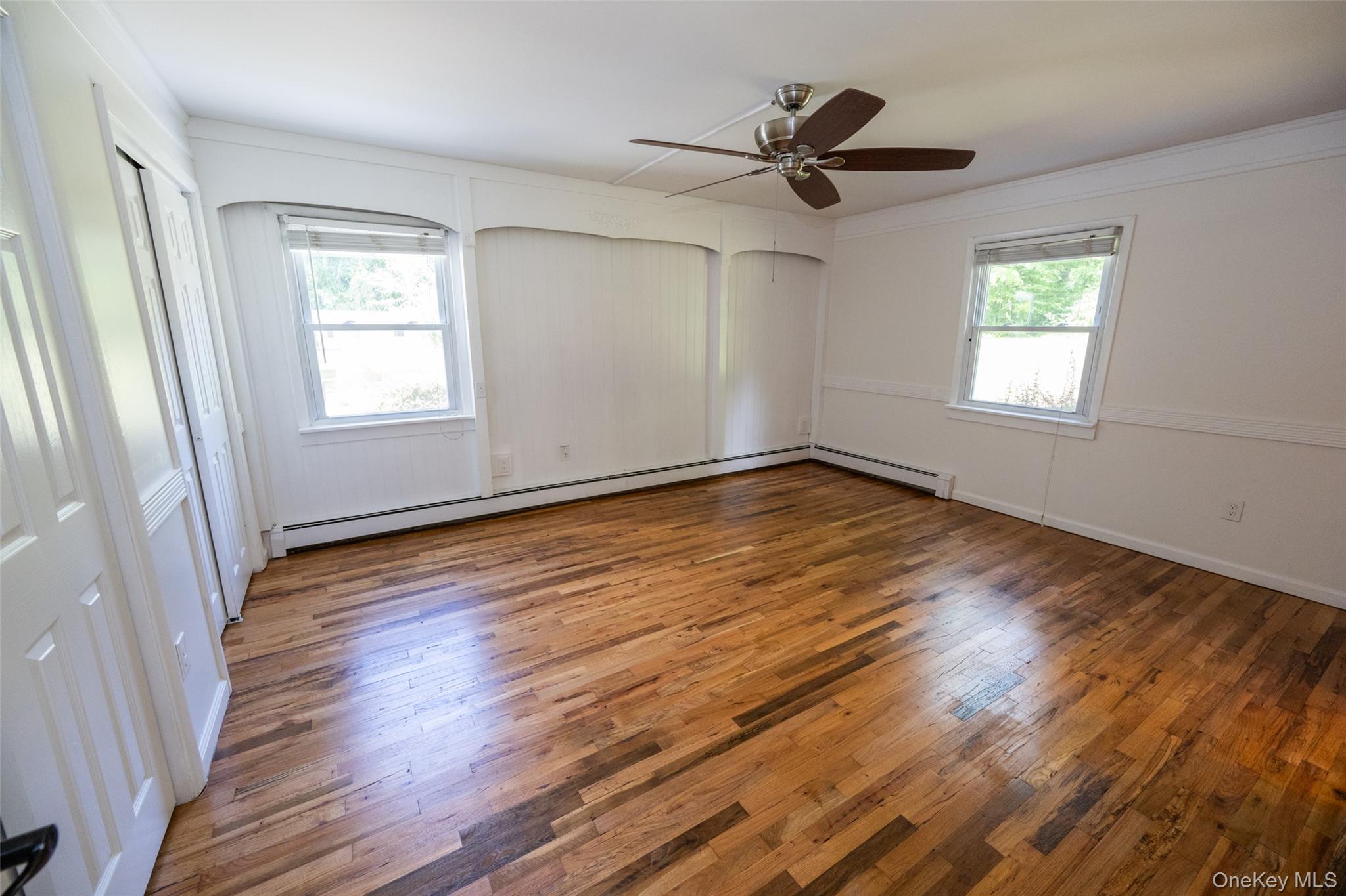 136 Foggintown Road Brewster, NY 10509 - Photo 22 of 50 a view of empty room with wooden floor and fan