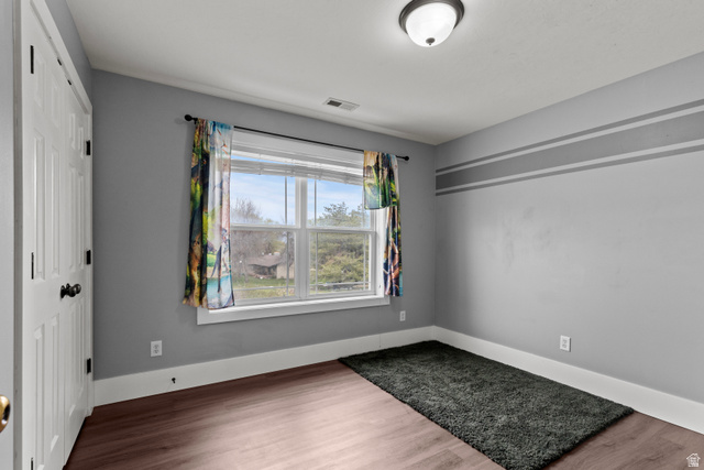 75 East 200 North Mendon, UT 84325 - Photo 21 of 36 Empty room with wood finished floors and baseboards