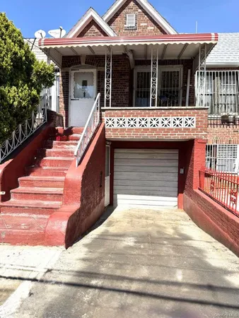 a view of a house with entrance gate
