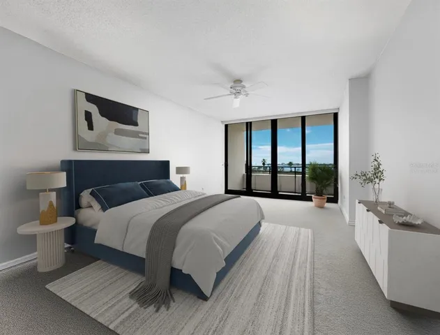 a spacious bedroom with a large bed and a window