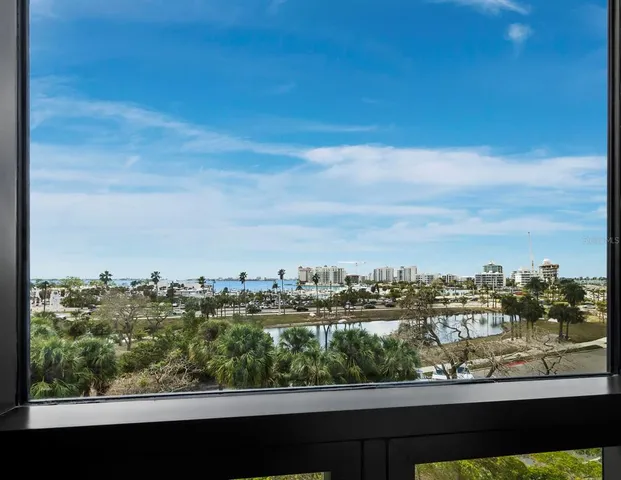 a bedroom with a bed and a table