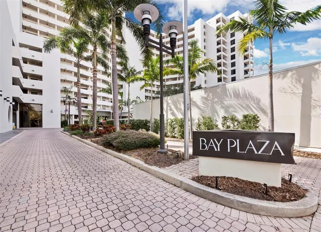a view of a street with a building in the background