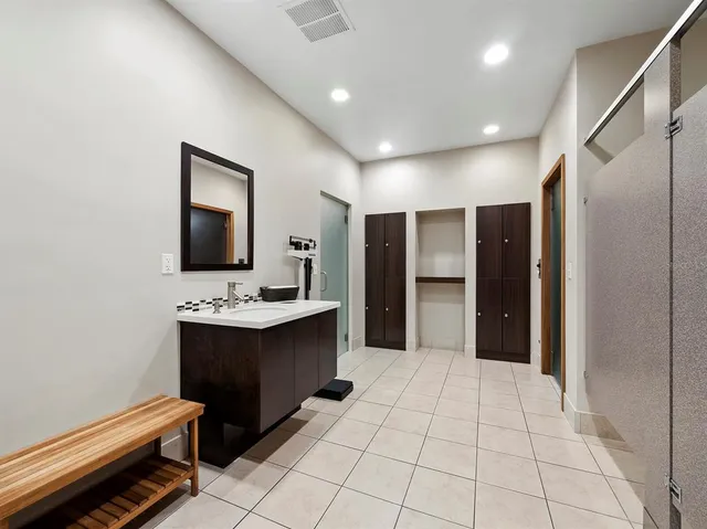 a view of a patio with table and chairs and potted plants