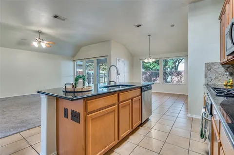 a view of a house with yard and a garden