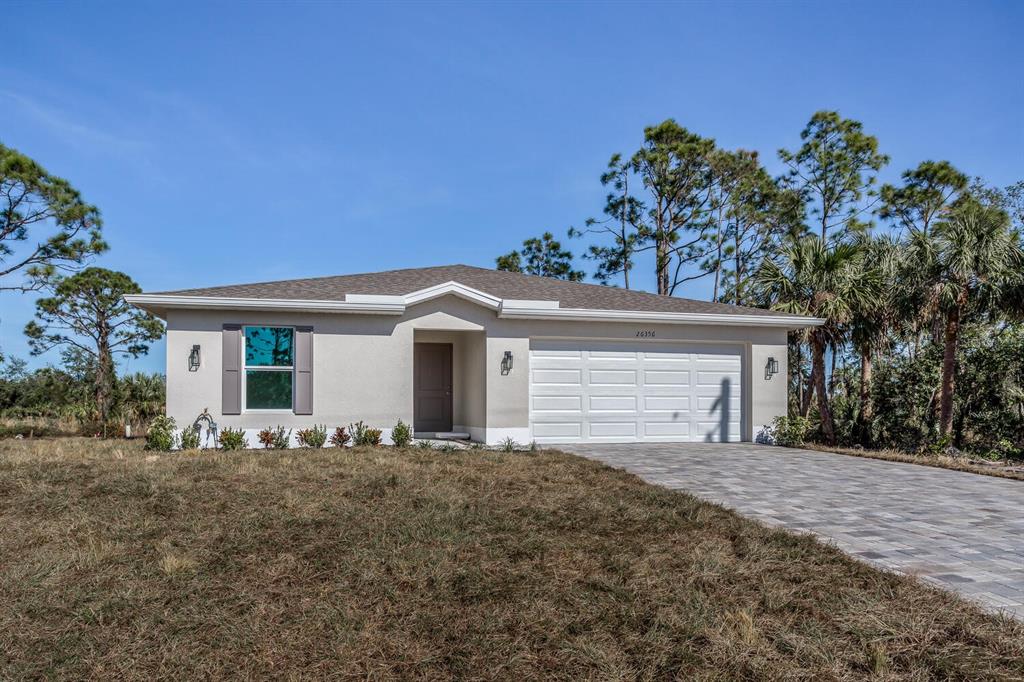 26356 Brooks Road Punta Gorda, FL 33955 - Photo 1 of 1 a front view of a house with a garden