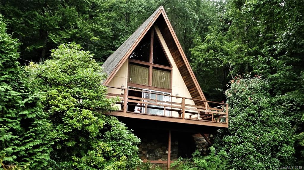 a view of house with trees in the background