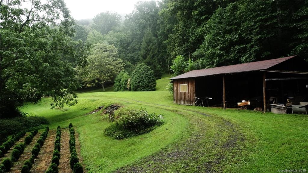360 Banjo Branch Road Burnsville, NC 28714 - Photo 11 of 17 a view of a couches in backyard of house