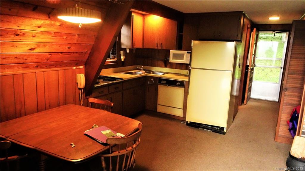 360 Banjo Branch Road Burnsville, NC 28714 - Photo 14 of 17 a bed room with a bed and a flat screen tv