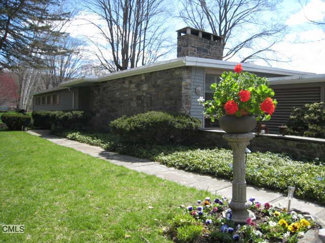 16 Macedonia Brook Road Kent, CT 06757 - Photo 1 of 1 a front view of a house with a yard and a fountain