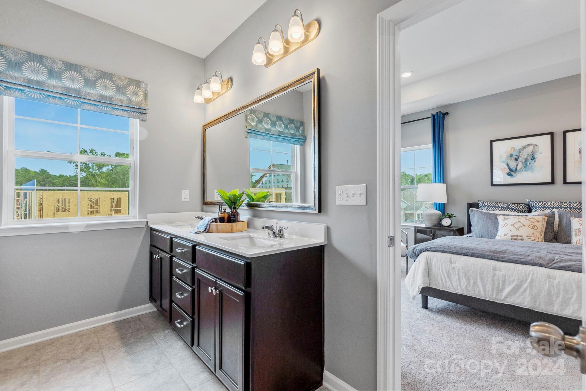 7902 Nelson Road Mint Hill, NC 28227 - Photo 14 of 30 a en suite bathroom with a granite countertop sink and a mirror