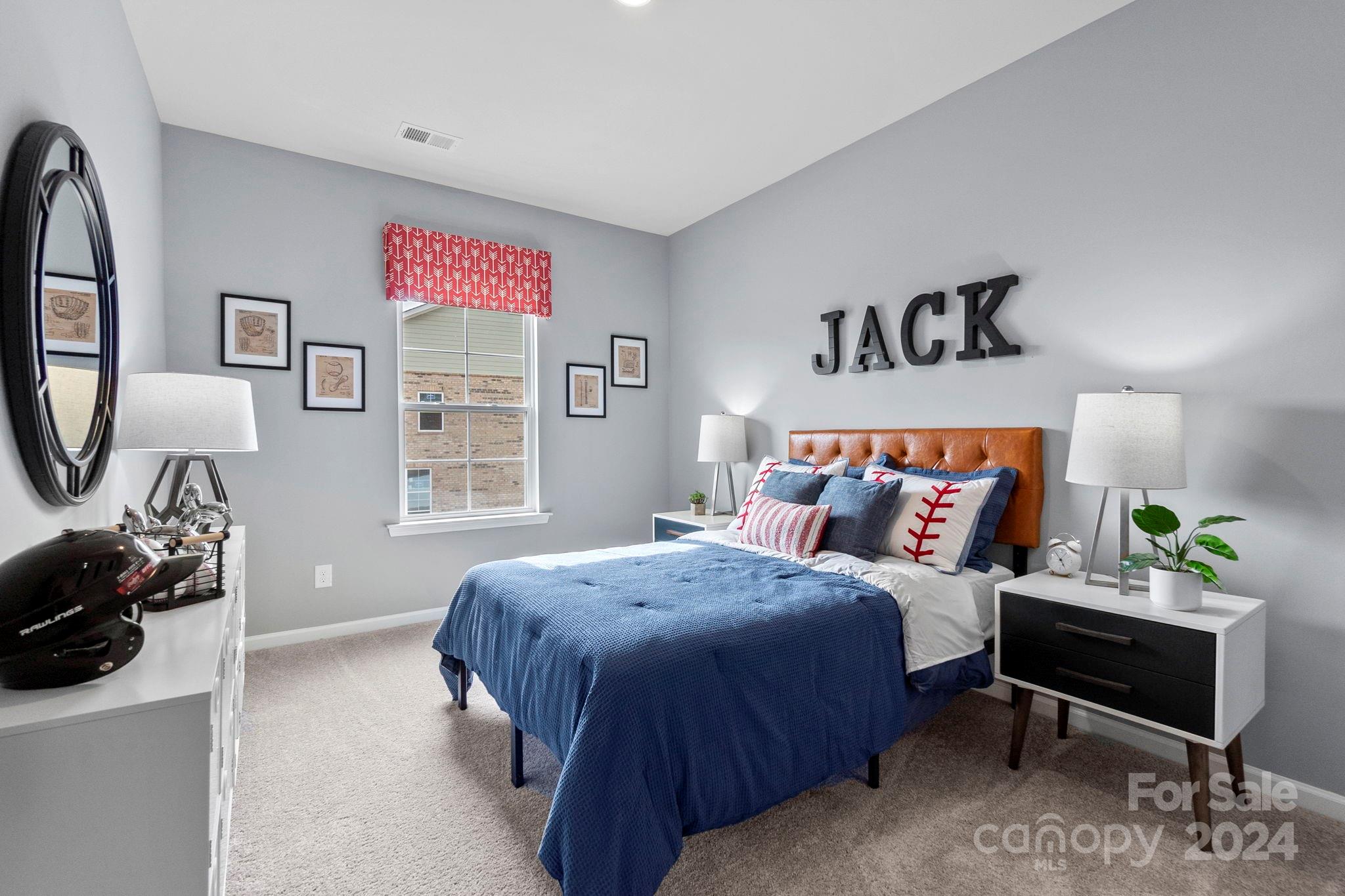 7902 Nelson Road Mint Hill, NC 28227 - Photo 17 of 30 a bedroom with a bed and a couch