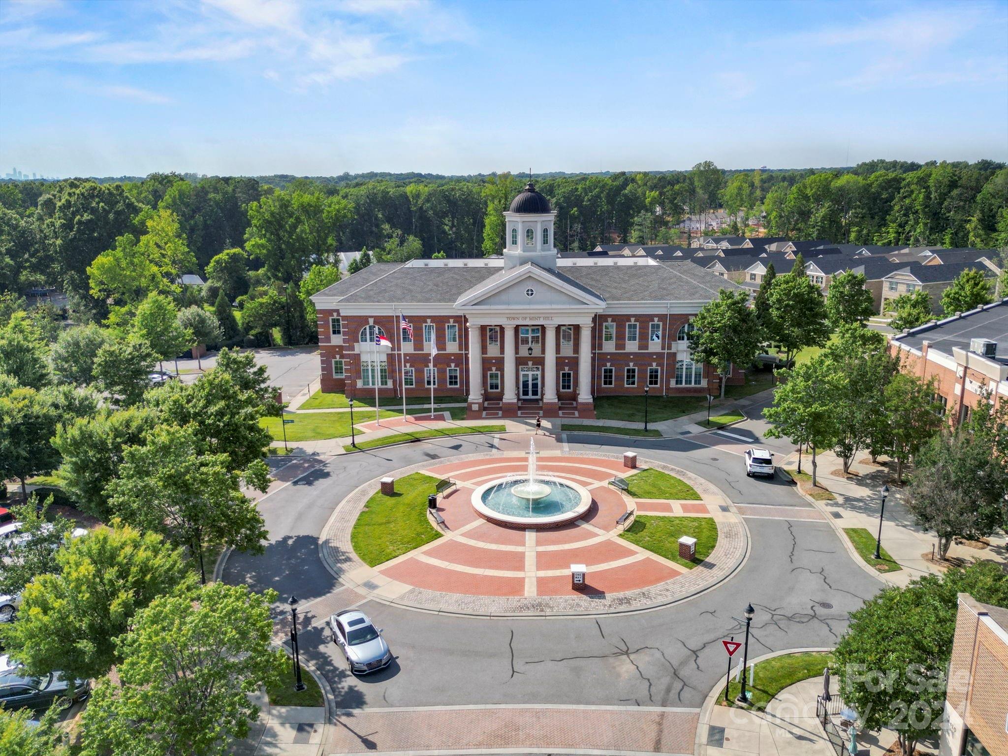 7902 Nelson Road Mint Hill, NC 28227 - Photo 21 of 30 a view of a swimming pool with lawn chairs under an umbrella