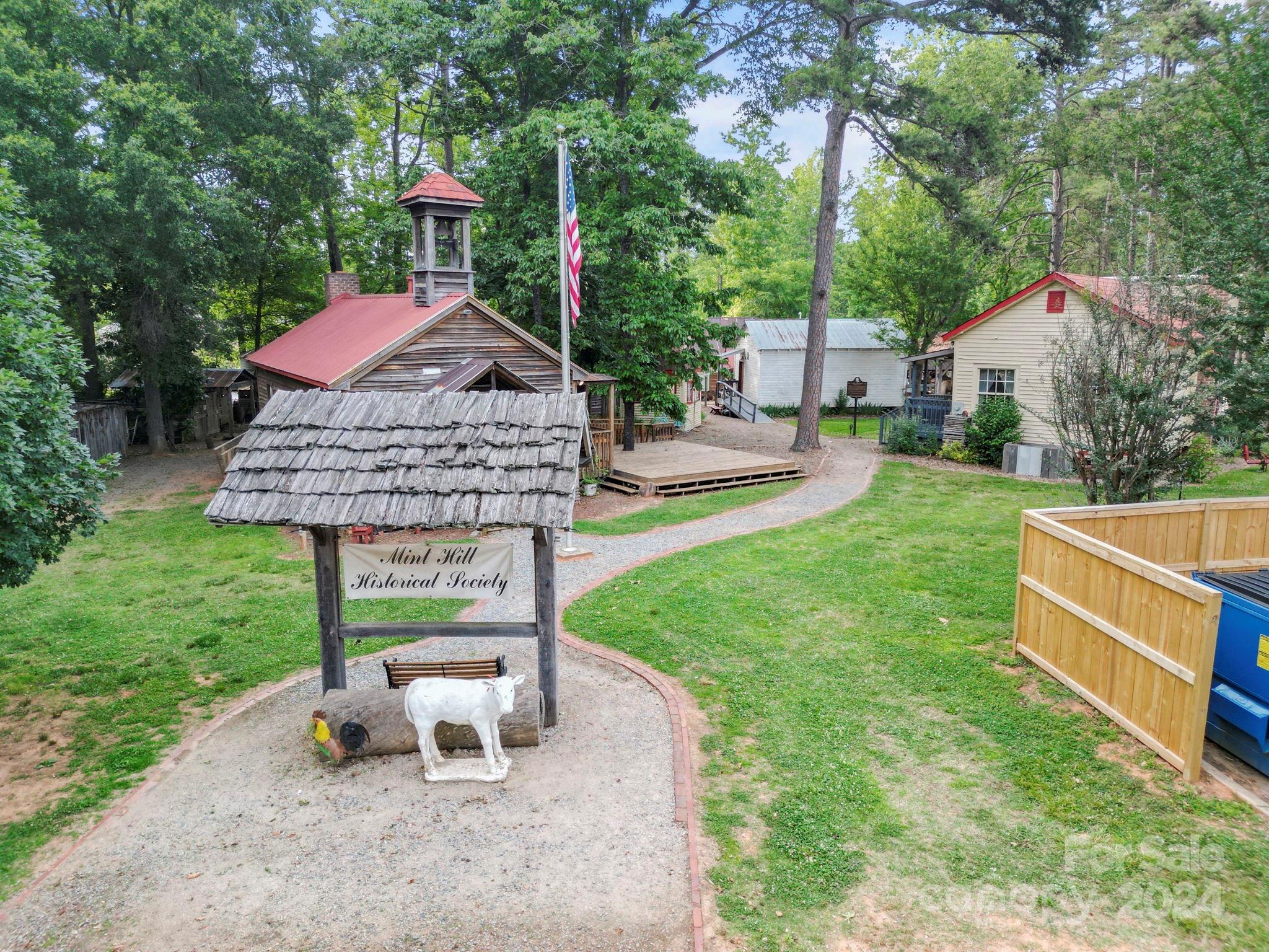 7902 Nelson Road Mint Hill, NC 28227 - Photo 24 of 30 a view of a house with backyard and a sitting area