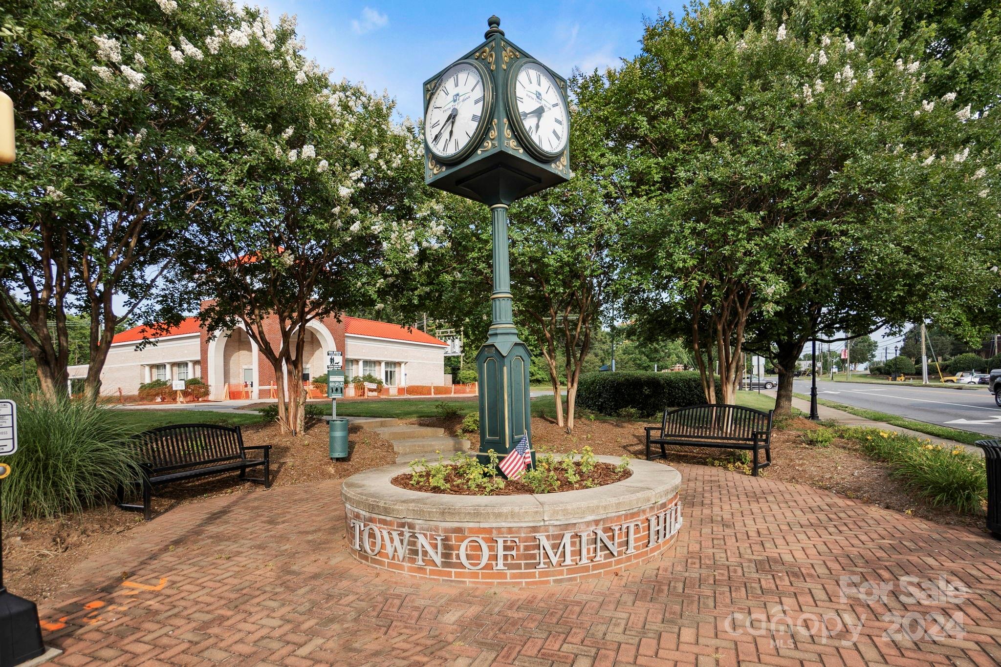 7902 Nelson Road Mint Hill, NC 28227 - Photo 29 of 30 a front view of a house with a garden and trees