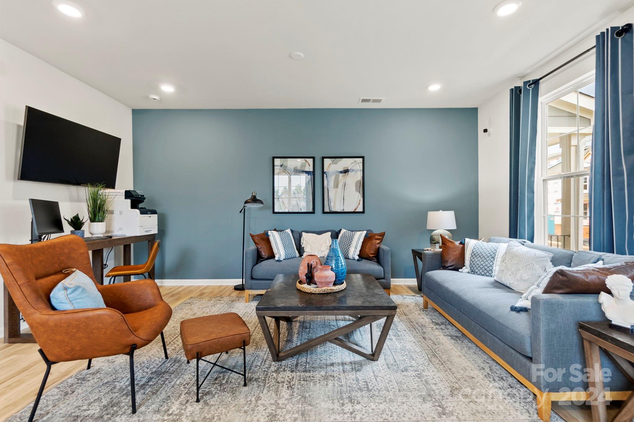 7902 Nelson Road Mint Hill, NC 28227 - Photo 4 of 30 a living room with furniture and a flat screen tv