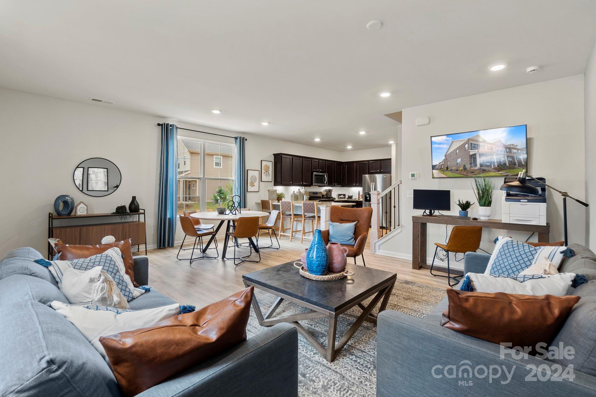 7902 Nelson Road Mint Hill, NC 28227 - Photo 5 of 30 a living room with furniture and a flat screen tv