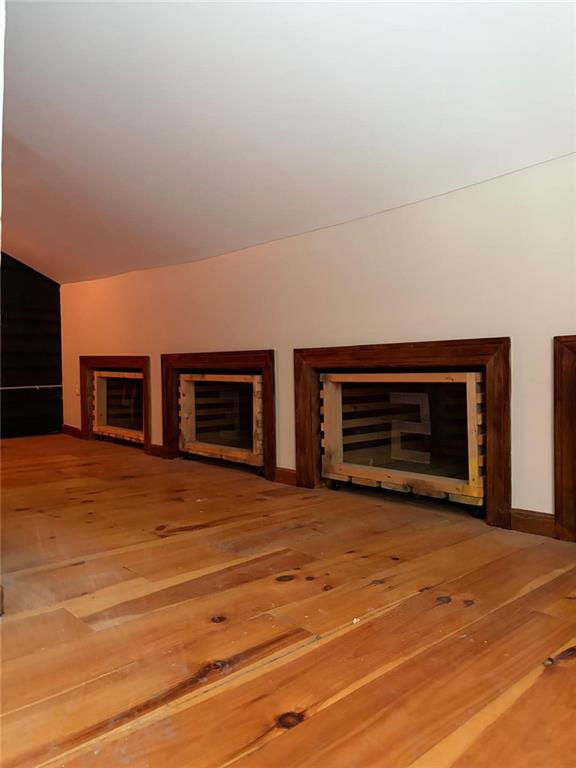 607 Middle Street Pittsburgh, PA 15212 - Photo 38 of 47 Right side of the room..knee wall storage. These "boxes" are actually custom-built rolling storage bins or drawers designed to utilize the dead space... clothes, shoes etc.