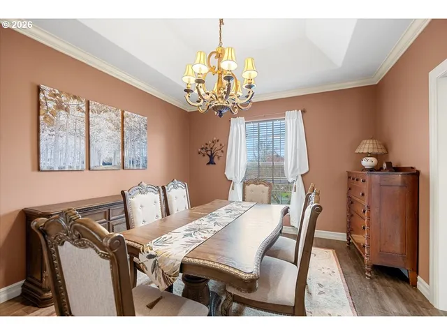 a view of a dining room with furniture and window