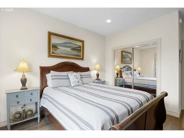 a bedroom with a bed and lamp