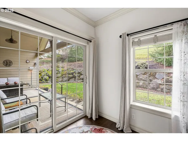 a view of a room that has a large window