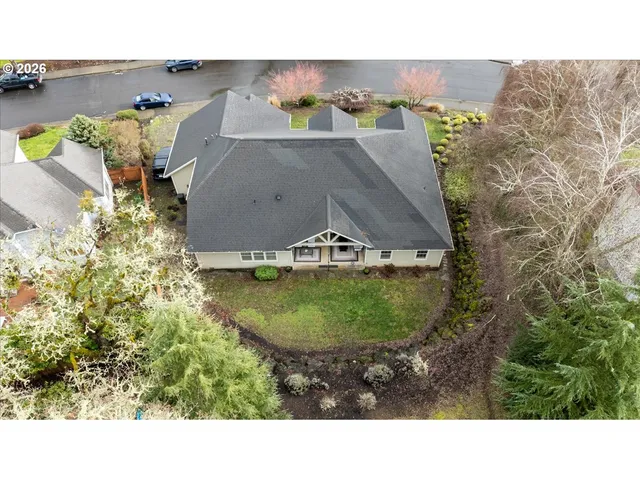 a picture of a house with a yard and sitting space