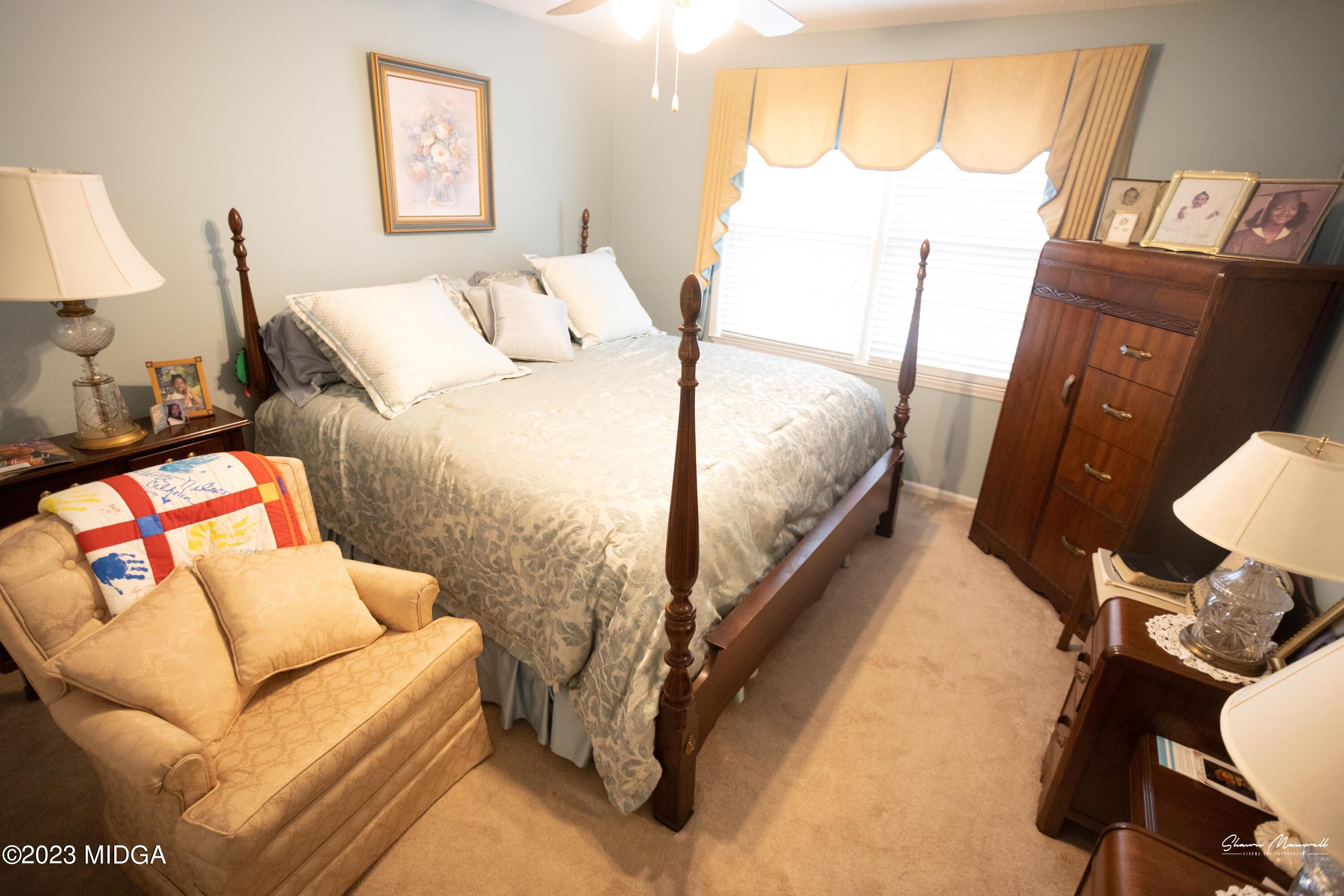 2885 Portland Place Macon, GA 31211 - Photo 24 of 26 a bedroom with a bed couch and a window
