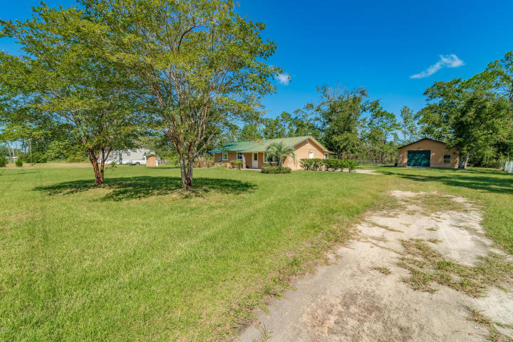 713 Newman Point Road Southport, FL 32409 - Photo 1 of 1 a view of yard with swimming pool and green space