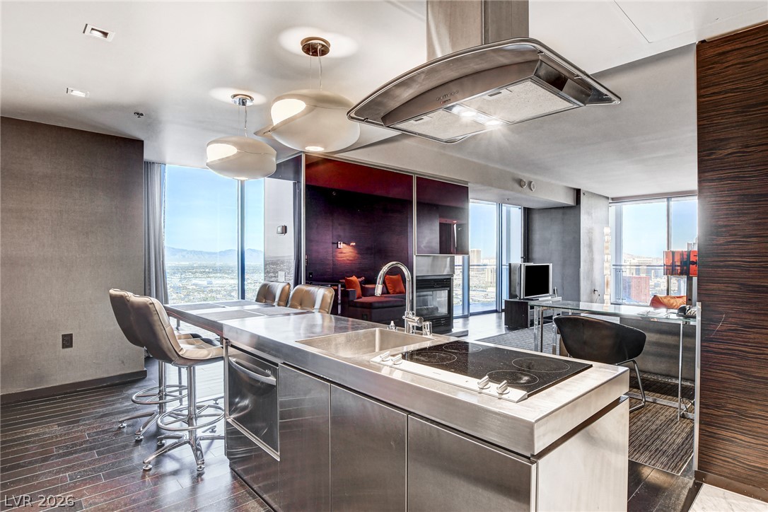 4381 West Flamingo Road, Unit 3002 Las Vegas, NV 89103 - Photo 56 of 59 Floor-to-ceiling windows flood this modern open-concept space with natural light.