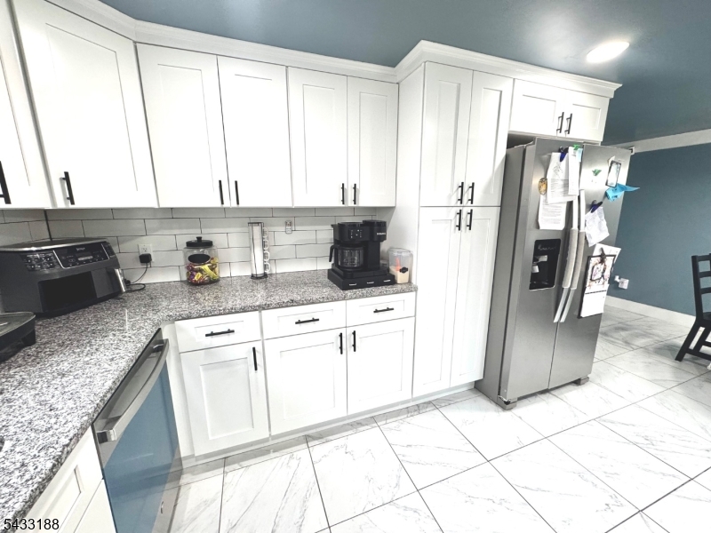 13 Highway 46 Columbia, NJ 07832 - Photo 8 of 22 a kitchen with a refrigerator a sink and cabinets