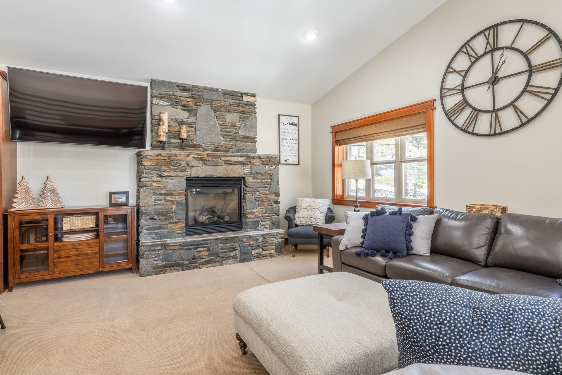 125 Davison Road, Unit 1 Mammoth Lakes, CA 93546 - Photo 3 of 46 a living room with furniture a fireplace and window
