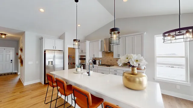 a kitchen with sink and refrigerator