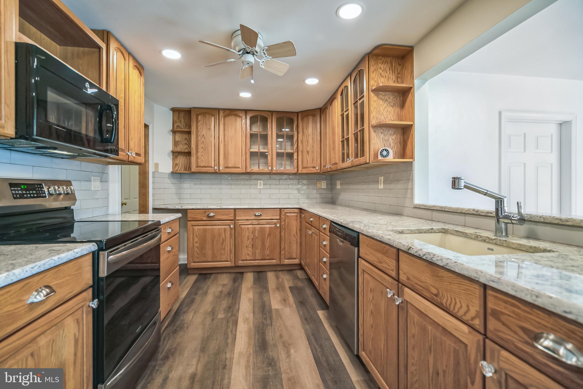 5922 Stoney Hill Road New Hope, PA 18938 - Photo 19 of 47 Kitchen has subway tile and granite counters