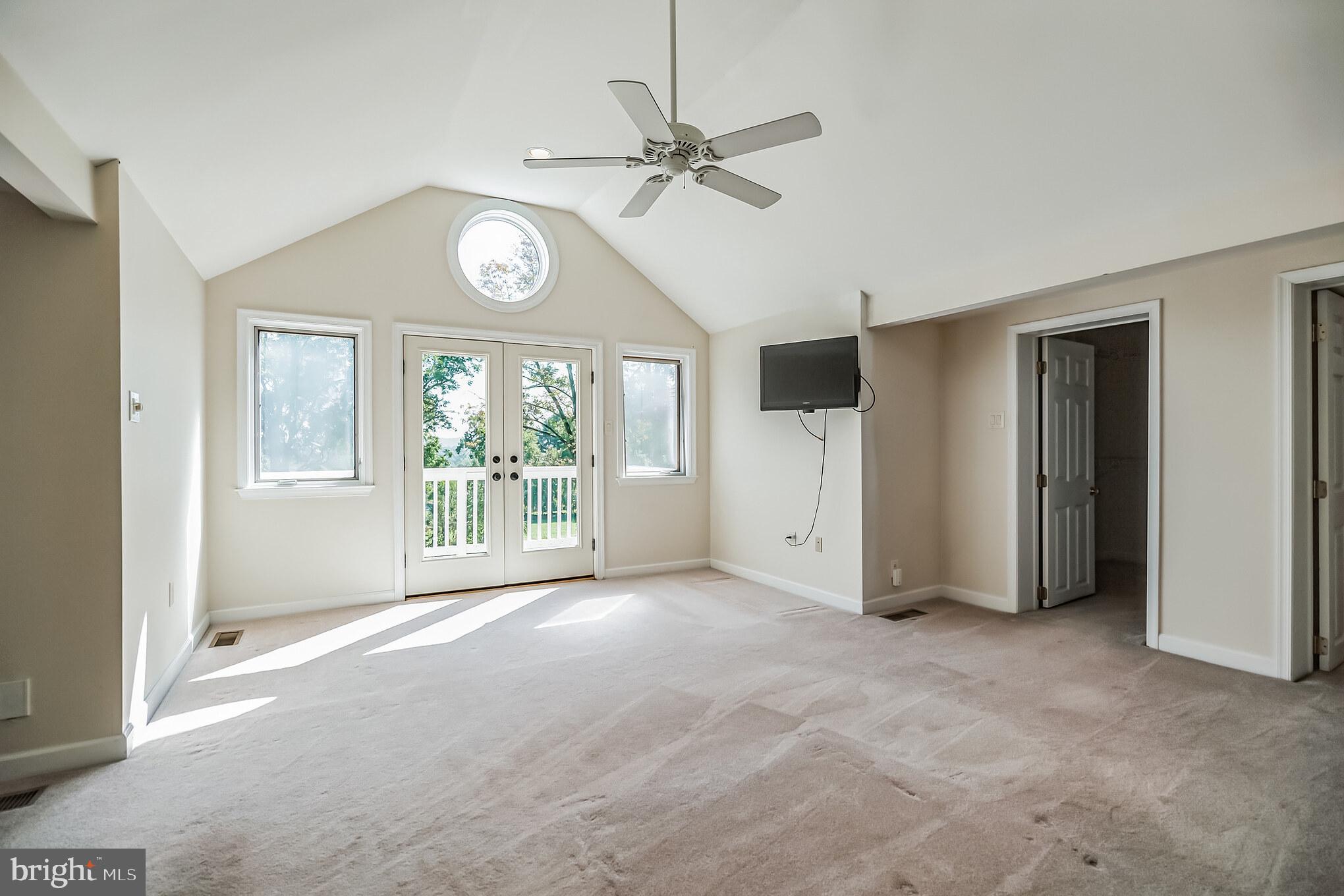 5922 Stoney Hill Road New Hope, PA 18938 - Photo 25 of 47 Primary bedroom with balcony overlooking the yard