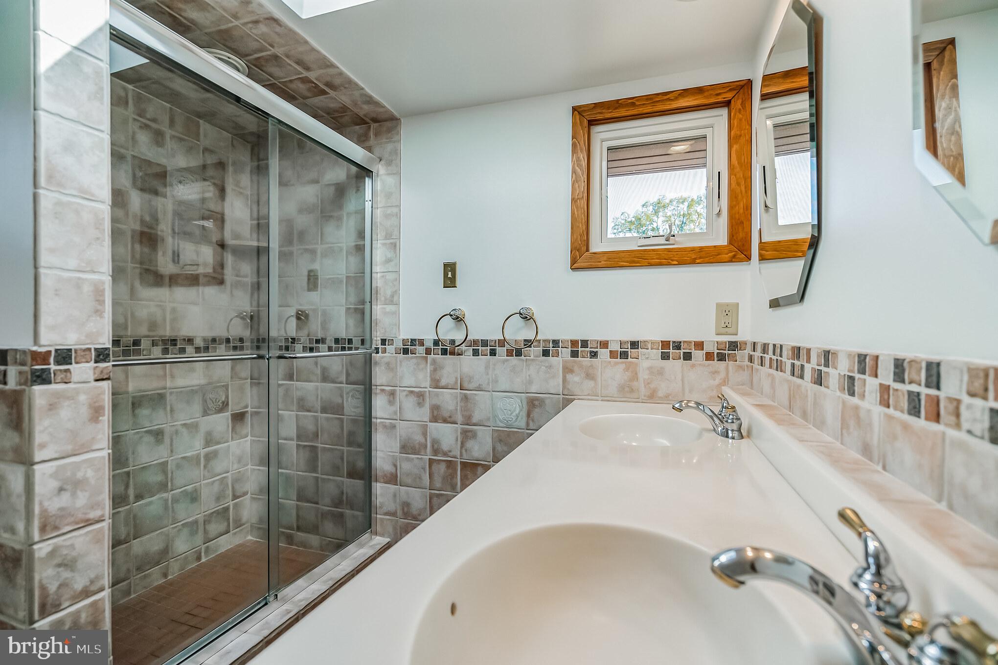 5922 Stoney Hill Road New Hope, PA 18938 - Photo 28 of 47 Primary Bathroom with double sink, walk-in shower