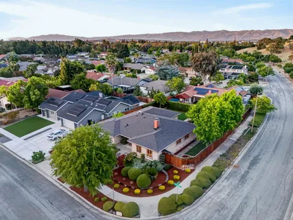 an aerial view of residential houses with outdoor space