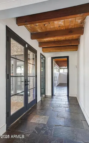a view of living room with furniture and a fireplace
