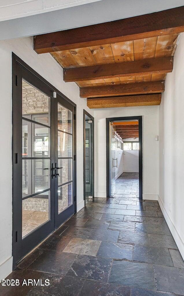 902 West Verde Lane Phoenix, AZ 85013 - Photo 12 of 44 a view of a hallway with wooden floor and a large window