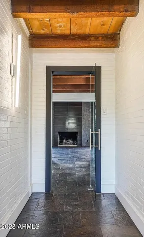 a view of an empty room with a fireplace