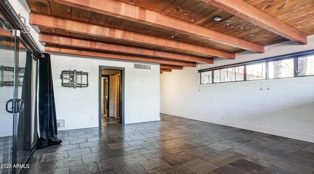 a view of a room with rack on the wall