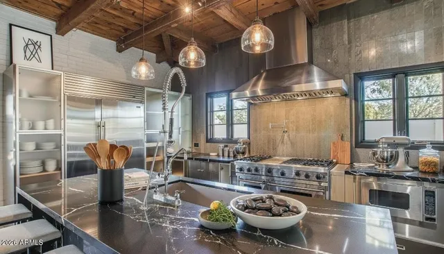 a view of living room with furniture and a fireplace
