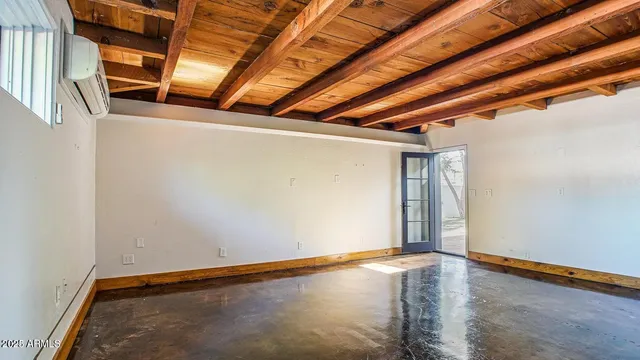 an aerial view of residential houses with outdoor space and river