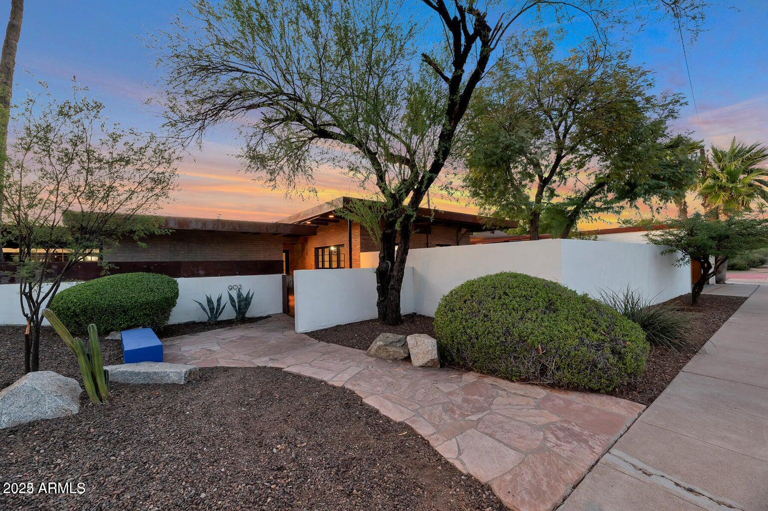 902 West Verde Lane Phoenix, AZ 85013 - Photo 8 of 44 a front view of a house with garden